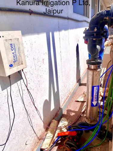 Stainless steel ScaleOff inline water conditioner with wall mounted control panel at Kanura Irrigation Jaipur